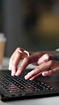 Hands, laptop and typing at office, night and project management with research at startup media company. Person, writer or journalist with computer, article and editing process at creative agency