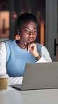 Black woman, laptop and thinking at startup, night and project management with review at media company. Person, writer and computer with decision for article, editing or deadline at creative agency