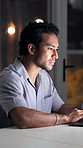 Man, laptop and typing at startup, night and project management with review at media company. Person, writer and computer with overtime for article, editing report and deadline at creative agency