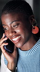 Phone call, night and black woman on laptop in office for communication, contact and story update. Creative, working late and person on smartphone for conversation, feedback and article submission
