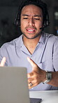 Night, call center or man in office with argument, customer issue or anger in client assistance. Frustrated, telecom or agent in workplace with tech, miscommunication or bad service on late shift.
