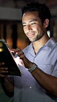 Night, media agency and happy man in office, tablet and app with publication, website blog and email. Evening, person and journalist with tech, scroll and research for news report and online reading