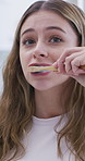 Woman, toothbrush and cleaning with toothpaste for dental hygiene, morning routine or oral care. Female person, bamboo stick and brushing teeth with paste for mouth or gum healthcare in house or home
