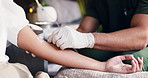 Doctor, hands and patient with arm for IV drip, injection or healthcare treatment in clinic. Closeup, health worker or nurse with artery vein or nutrition for medical remedy, vitamins or medicine