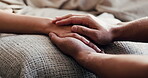 Empathy, holding hands and support with people in home together for emotions, grief or loss. Help, love and trust with friends closeup in living room of apartment for healing, recovery or wellness