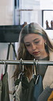 Shopping, search and retail with woman in store for boutique, decision and style option. Fashion merchandise, clothing rack and apparel with person in mall for sale, discount and customer choice