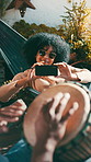 Drum, smile and woman with phone, man and music for bonding and summer vacation. Musician, friends and instrument for holiday with sunglasses, hammock and relax in backyard for creative streaming