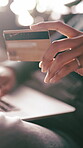 Credit card, typing or hands in home with laptop, online banking or payment in eft transaction. Bokeh, easy purchase or woman in house with tech, fintech system or debit details in cashless service.