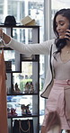 Clothing rack, phone call and shopping with woman in store for choice, outfit selection or variety. Clothes, conversation and retail with person in fashion boutique for browsing, decision or purchase