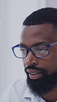 Glasses, planning and reading with business black man in office for research, account manager and review. Portfolio report, eyewear and online project with person in agency for proposal and idea