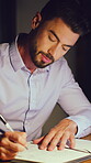 Writing, night or man in office with notebook, calendar plan or brainstorming for company pitch. Ideas, notes or person in agency with inspiration, schedule update or business proposal in overtime