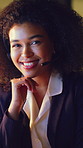 Happy woman, face and night consultant with headset for online advice or customer service in office. Portrait, female person or agent working late with smile for virtual assistance in call center