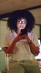 Woman, phone and night at office, texting or glasses with project deadline at media company. Person, smartphone and app at startup, networking and check notification for overtime at digital agency