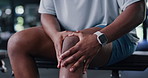 Person, hands and fitness with knee pain in gym for muscle tension, sprain or overworked. Closeup, active or injury with sore leg or bone for strain, joint inflammation or accident in health club