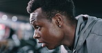 Fitness, sweaty and black man breathing in gym to recover, training exhaustion or finish exercise. Tired, workout complete and athlete with intense challenge for fatigue, relax or bokeh for wellness