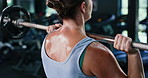 Sports, weightlifting and back of woman in gym for workout, training or bodybuilding for strength. Health, athlete and person with dumbbell equipment for exercise with bicep growth in fitness center.
