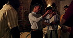 Dark, sommelier and people in cellar with glass for wine tasting, inspection or winemaking conversation. Winery owner, group and check alcohol drink with discussion for knowledge, advice or learning.