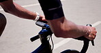 Athlete, hands and cycling with bicycle in road for fitness exercise, pace training or performance. Cyclist, person and bike ride outdoor for cardio workout, triathlon practice and wellness challenge
