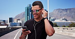 Technology, fitness or happy man on street for workout, streaming music or check start time for run. Sunglasses, earphones or athlete with smart watch for exercise progress, phone or outdoor space