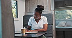 Relax, road trip and writing with black woman in caravan for adventure, holiday or vacation. Book, schedule and travel with happy African person in booth of RV for break, journaling or sightseeing