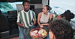 Charcuterie, board and friends with conversation in caravan, road trip and snack platter for connection. Bonding, speaking and happy people with healthy food for journey, high angle or travel holiday