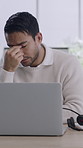 Tired, businessman and consultant with headset, headache or stress for fatigue or burnout in office. Exhausted, man or agent with laptop, migraine or eye strain for virtual assistance or mistake