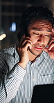 Man, phone call and headache at night, startup and tired with contact for story lead at media company. Person, journalist and smartphone with laptop, talk and overtime for article at creative agency