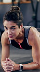 Thinking, woman and plank for fitness in gym for exercise, core strength and balance bodyweight. Female person, floor and intense training for abs, bodybuilding challenge and bicep workout for health