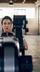 Workout, rowing machine and woman in gym for energy, wellness or sports for body health. Health club, person and exercise on ergometer for fitness, muscle strength or core training for cardio