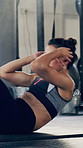 Athlete, woman and situps for fitness in gym for exercise, core strength and balance bodyweight. Female person, floor and intense training for abs, bodybuilding challenge and bicep workout for health