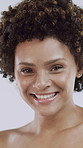 Beauty, wink and face of woman in studio for skincare, shine and self care. Happy, dermatology and glow with portrait of female person on white background for clear skin, pride and hydration