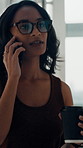 Office, talking and woman with coffee, phone call or serious for pr project, flare and communication. Creative, publicist and person for mobile for discussion, glasses and walk with latte in business