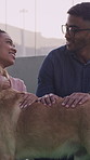 Adoption, choice and couple in center with dog, bonding together and pet selection at animal shelter. Happy, man and woman in sanctuary with puppy, connection and foster decision at nonprofit agency.