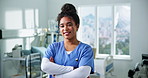 Face, nurse and happy woman with confidence for healthcare career, about us and pride in icu. Portrait, person and medical worker in hospital, arms crossed and wellness with critical care surgeon