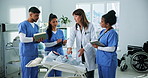 Doctor, nurses and baby model in clinic for training, research and teamwork or management. Healthcare professionals, people and pediatrician with child mannequin for internship, schedule or meeting
