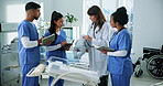 Doctor, nurses and child doll in hospital for training, research and teamwork or management. Healthcare professionals, people and pediatrician with baby model for internship, cardiology or discussion