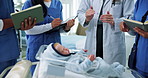Doctor, baby doll and students in hospital, hands and notebook with paedetrician. University, medical interns or people in clinic, neonatal or lesson with healthcare education, talking and writing