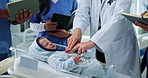 Doctor, baby doll and students in clinic, hands and notebook with paedetrician. University, medical interns or people in hospital neonatal or lesson with healthcare education, explain and writing