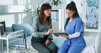 Tablet, nurse and healthcare with woman in hospital for diagnosis, advice and checkup appointment. Medical evaluation, digital report and disease assessment with people in clinic for symptoms history