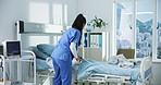 Woman, nurse and making hospital bed with cleaning, healthcare services and hygiene at wellness center. Person, porter and medical professional with blanket, change sheets and career at clinic