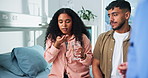 Fertility, pills and healthcare with couple in hospital for hormone therapy, consulting and help. Ivf treatment, ovulation stimulation and medical advice with man and woman drinking water in clinic
