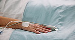 Hand, person and pulse oximeter on hospital bed, healthcare and measure blood levels. Closeup, senior patient and rest with medical machine, track oxygen and critical care from operation or recovery
