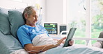 Tablet, happy and senior woman in hospital bed with reading blog on app for surgery recovery. Digital technology, rest and elderly female patient in retirement browsing on social media in clinic.