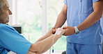 Holding hands, support and nurse with senior woman in hospital for checkup on surgery recovery. Professional, consultation and healthcare worker with elderly female patient for medical help in clinic