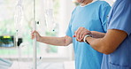 IV drip, walking and nurse with senior woman in hospital for medical help in recovery. Checkup, holding hands and healthcare worker with elderly female patient for mobility exercise in clinic.