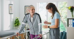 Senior, happy woman and physiotherapist with walking rail for assisted living, balance or mobility. Elderly, female person or physio helping patient with step or movement for recovery in clinic