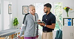 Clinic, tablet and physiotherapist with old woman, talking and digital report for recovery or online. Medical professional, discussion and people with technology for physiotherapy and rehabilitation