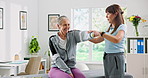 Healthcare, professional and physical therapist with senior woman in clinic with recovery. Medical support, arm exercise and physiotherapist with elderly female patient for muscle movement in office.