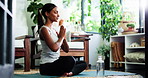 Woman, breathing and yoga in home with prayer hands for meditation, wellness or spiritual awareness. Zen, female person and stretching on floor with mudra for mindfulness, breathwork or namaste pose.