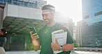 Walking, student and man in city with phone for learning, education and university. Travel, outdoor and person on smartphone with textbooks, social media and online chat for college opportunity